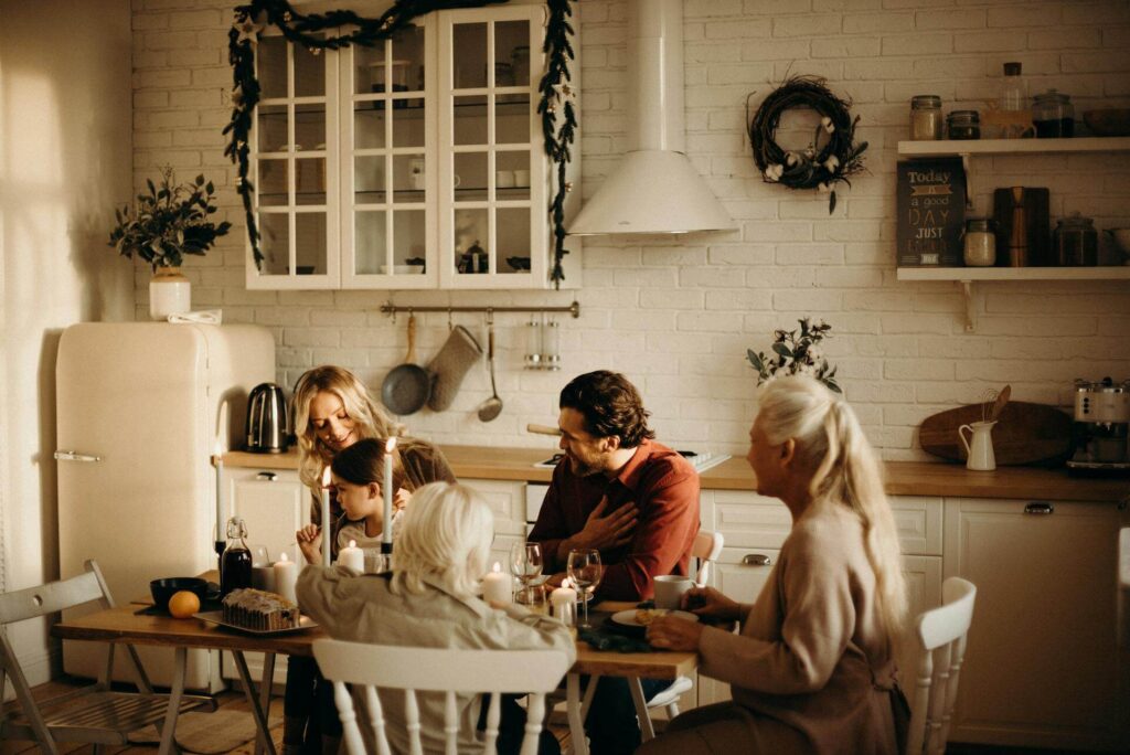 Family Sitting at Kitchen Table