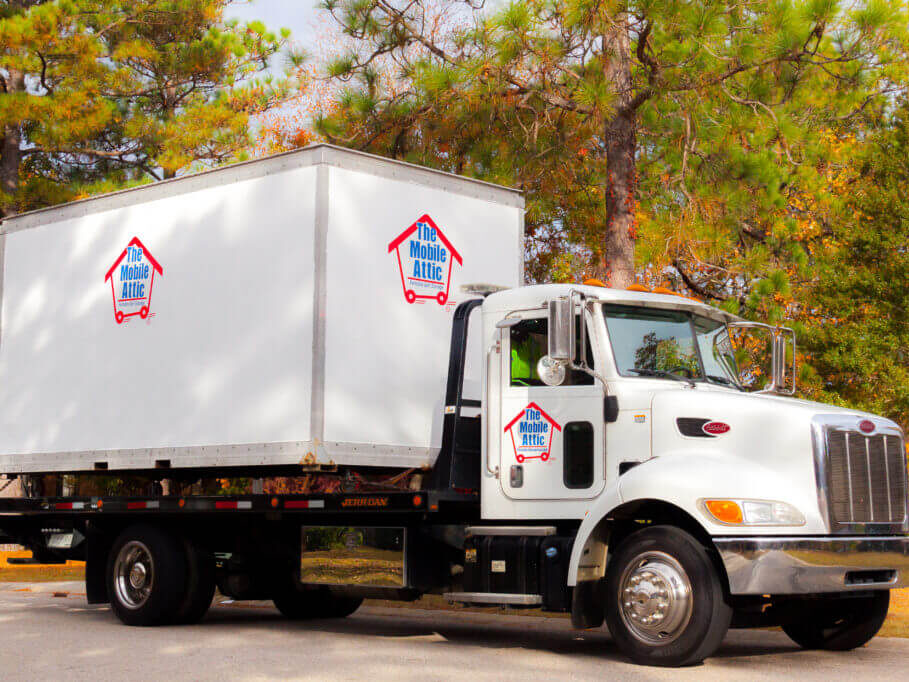 Mobile-Attic-Truck-with-green-and-orange-trees-Website-Image